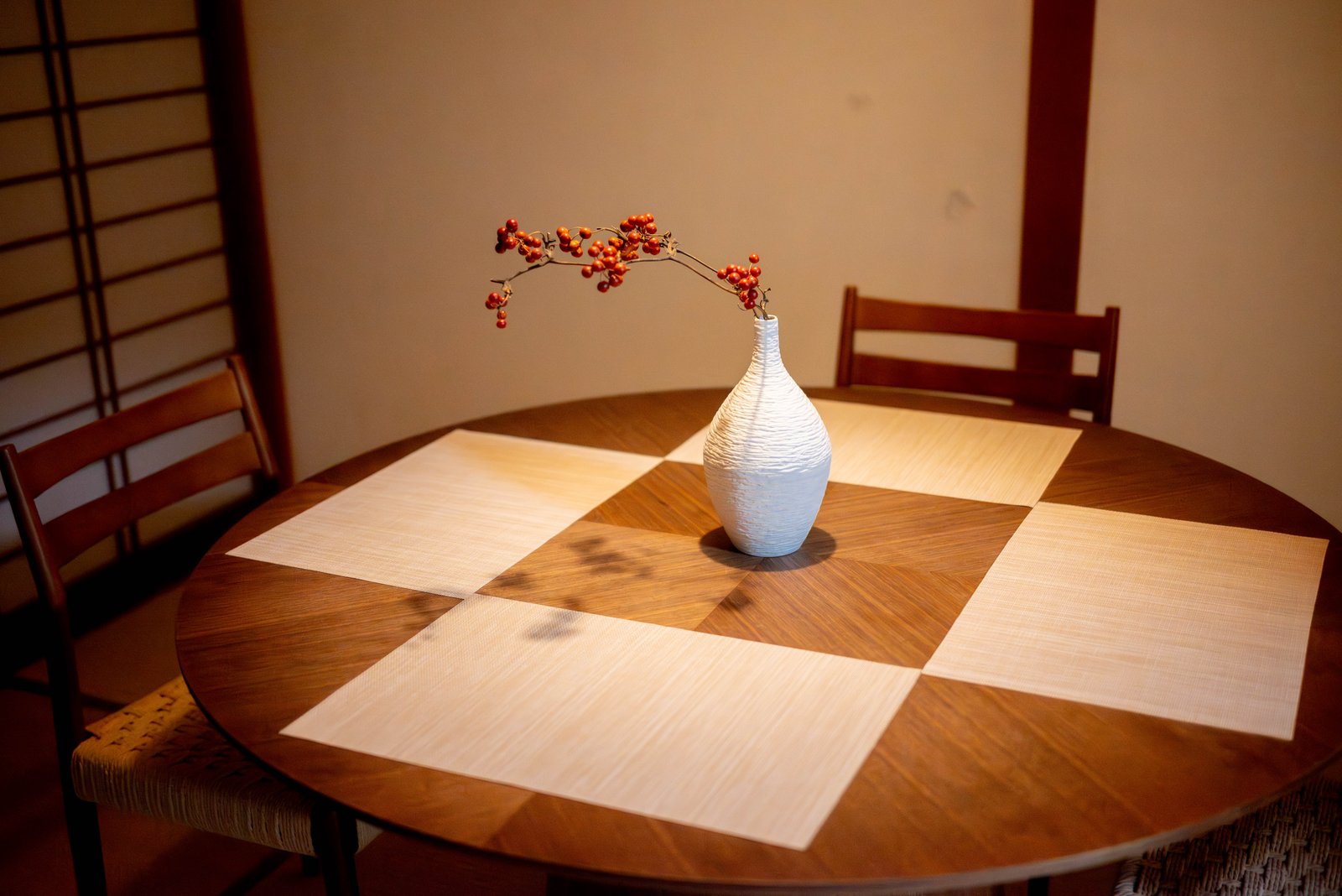 Nomachi Villa — dining table with warm light at night